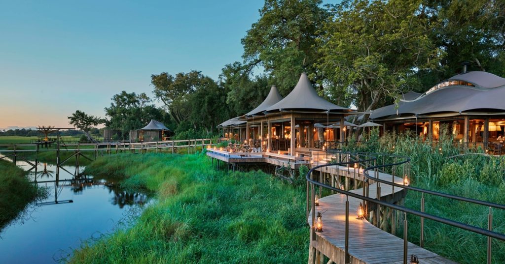 Walkway at dusk at Xigera Safari Lodge in the Okavango Delta, Botswana