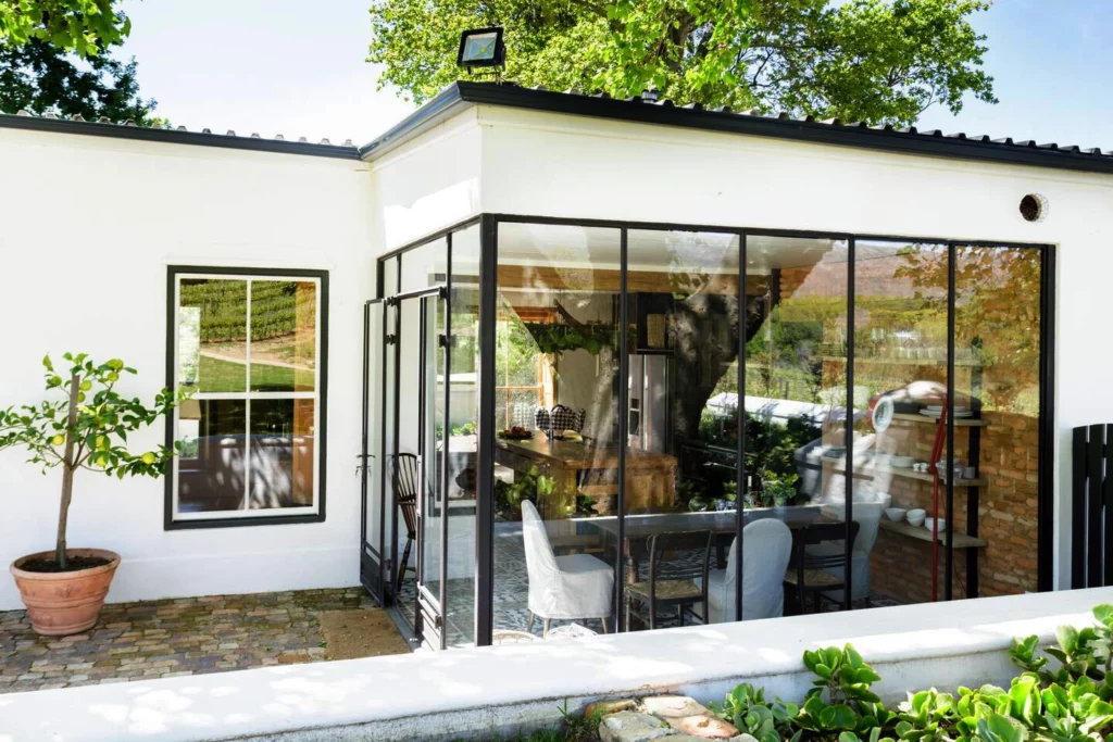 View of sunny kitchen and dining area at Hope Cottage, Constantia Winelands, Cape Town