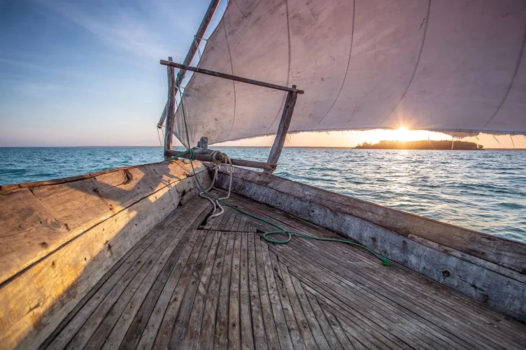 a traditional dhow on the sea in Zanzibar, Tanzania