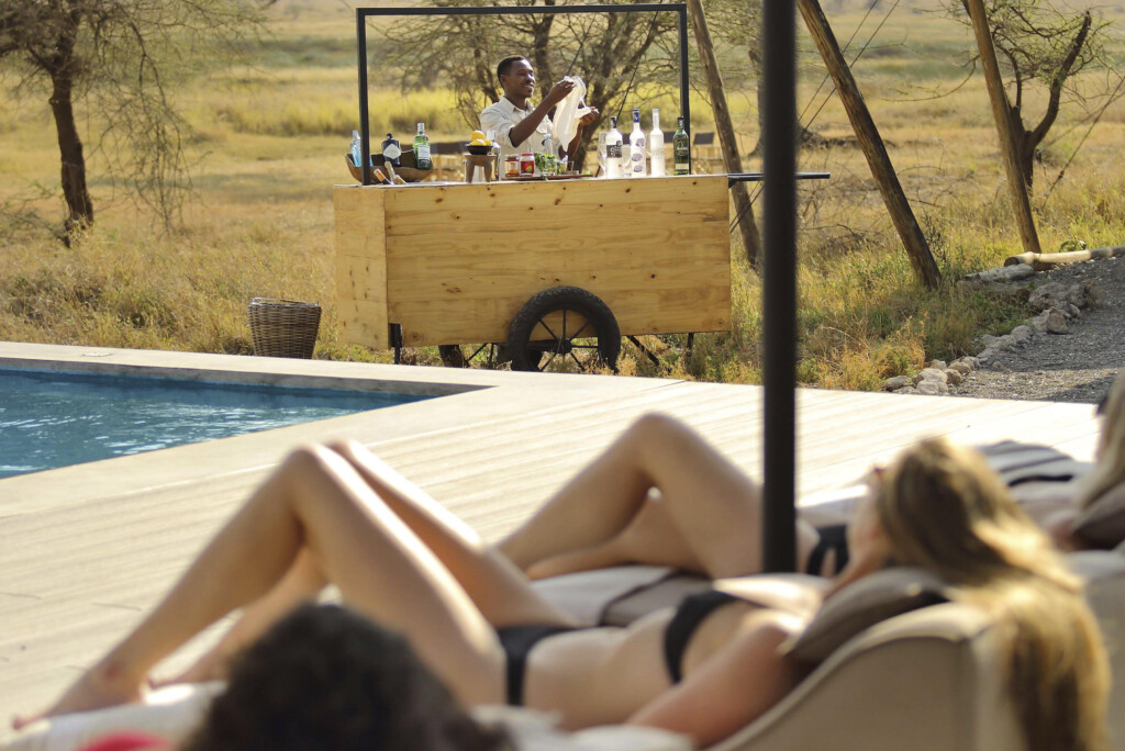 Namiri-Plains-Serengeti-Tanzania-safari-swimming pool-outdoors-bar